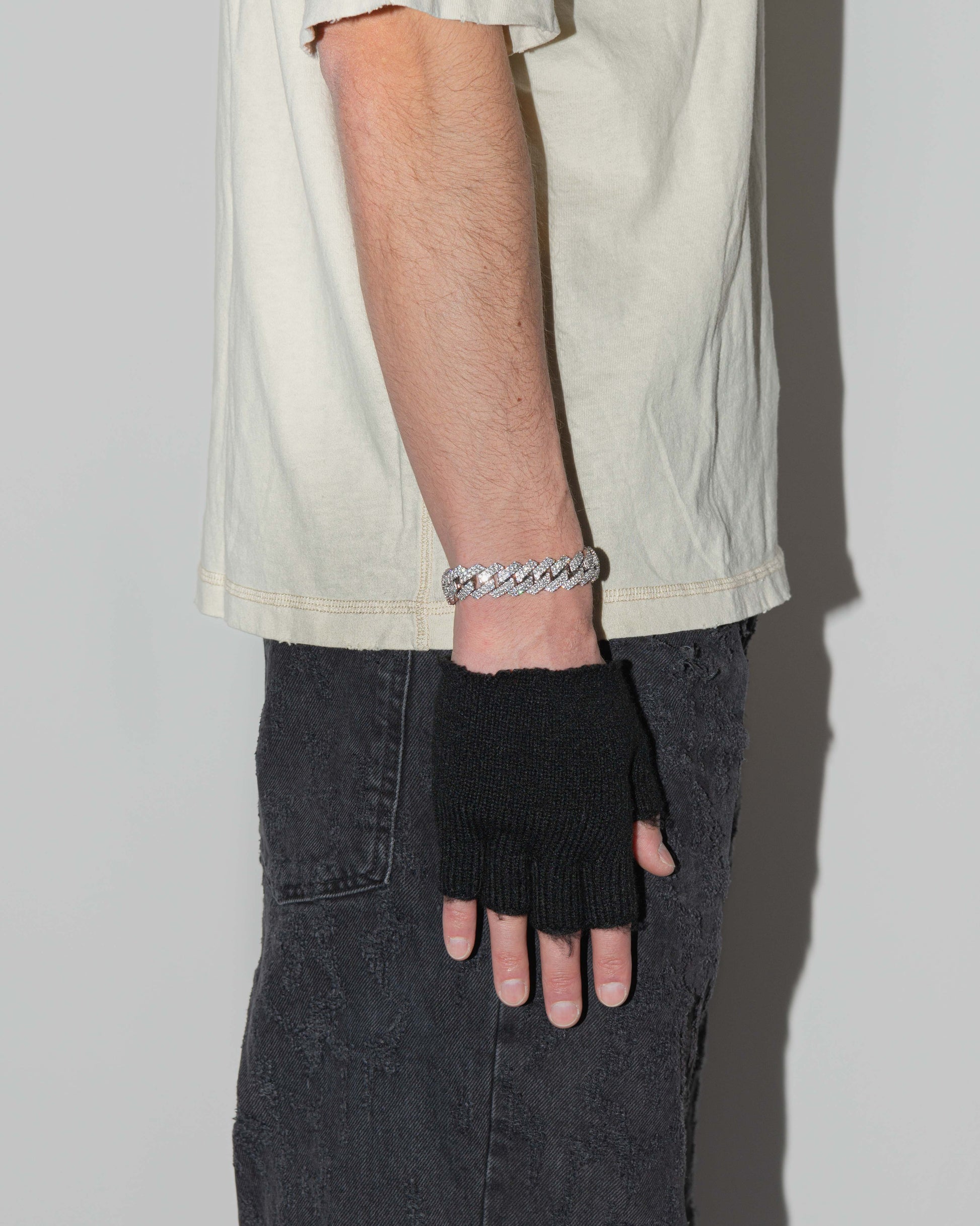 street style man wearing 18k white gold coated prong chain bracelet with hand-set micropavé stones in white